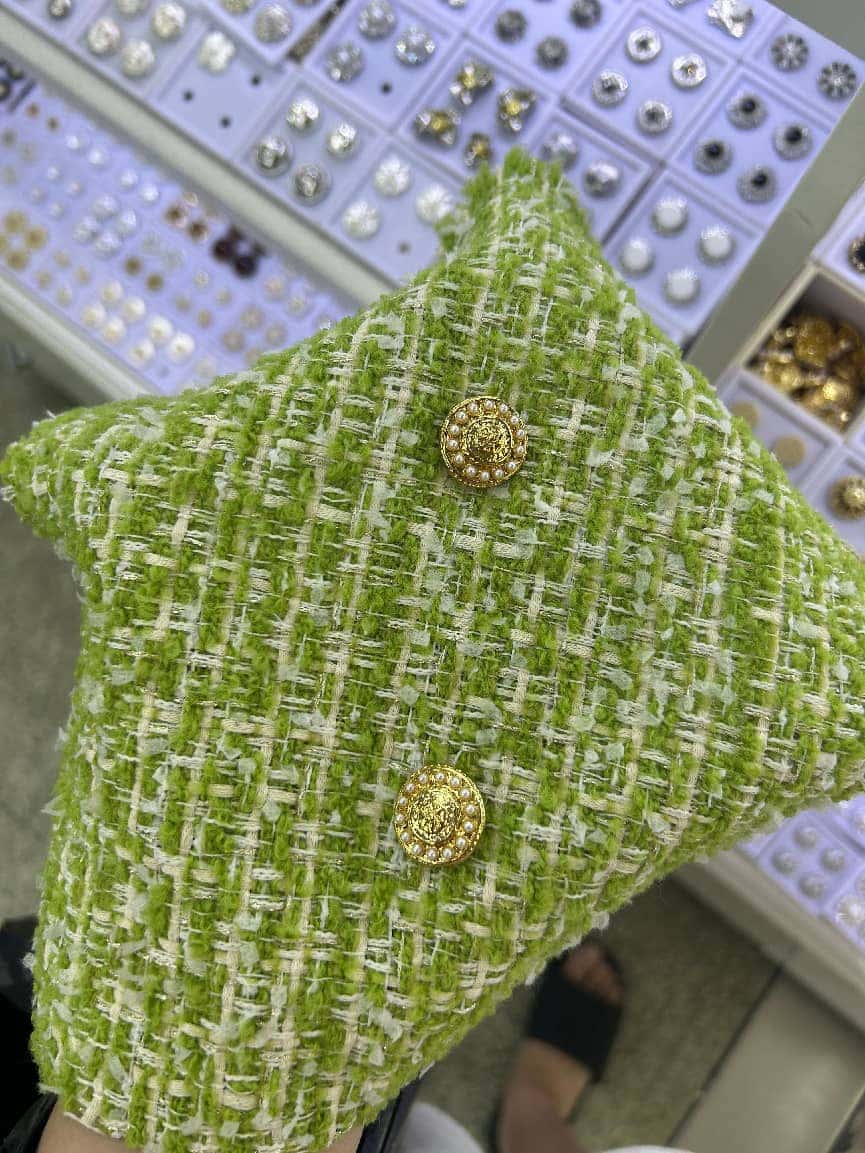 Tweed with jewel button — fabric developed by Belleza