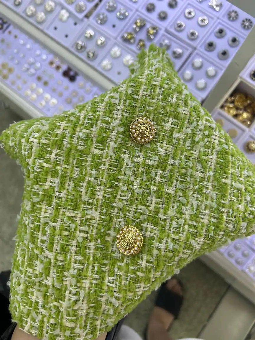 Tweed with jewel button — fabric developed by Belleza